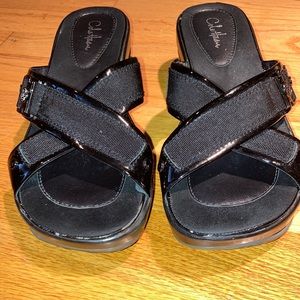 Women’s Cole Haan black sandals with Nike air soles.